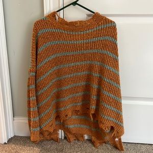 Orange and blue ripped sweater